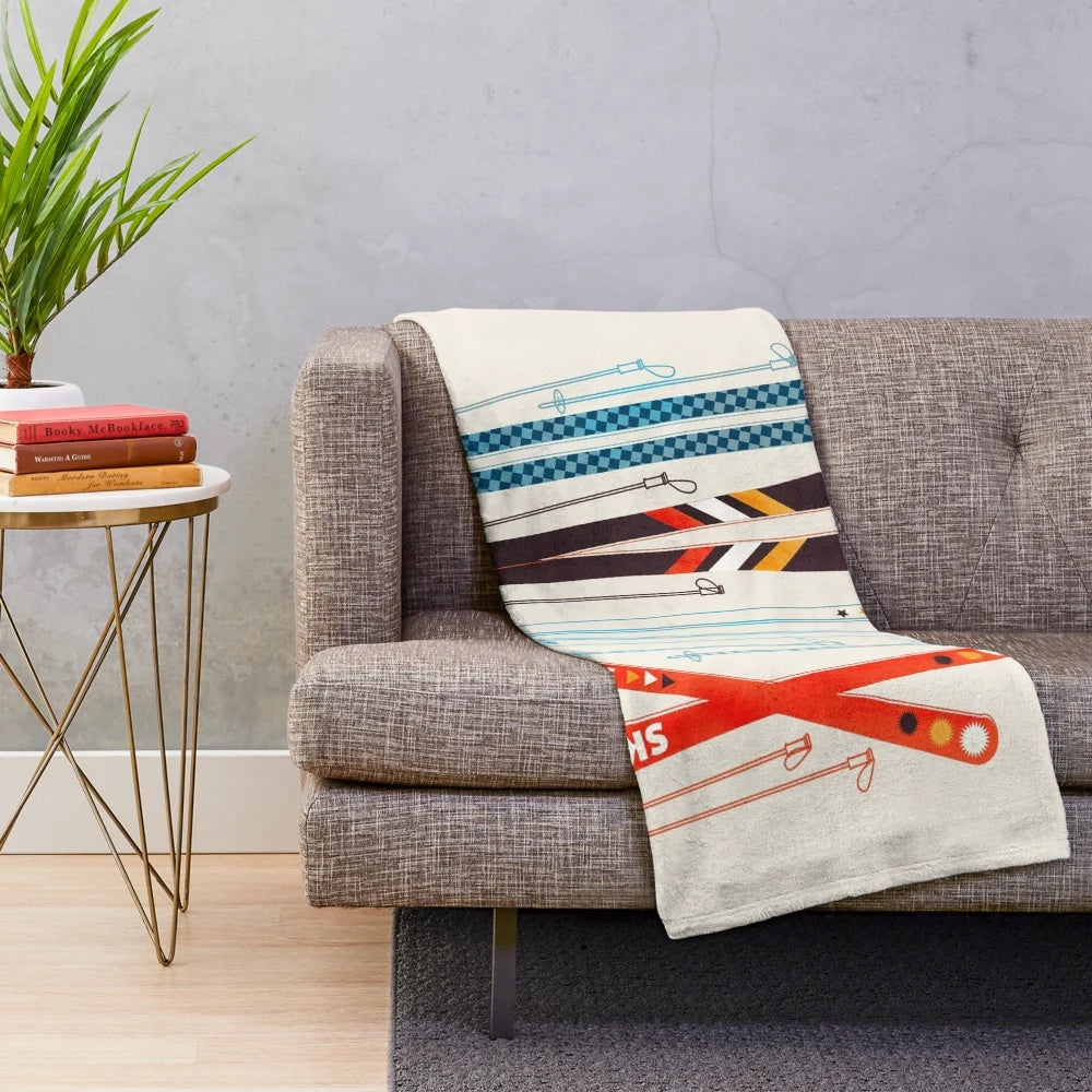 Colorful retro ski illustration printed on a soft, plush blanket
