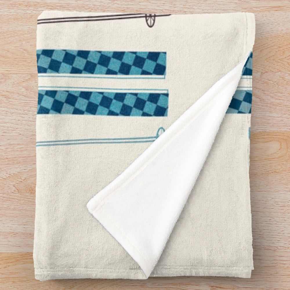Colorful retro ski illustration printed on a soft, plush blanket