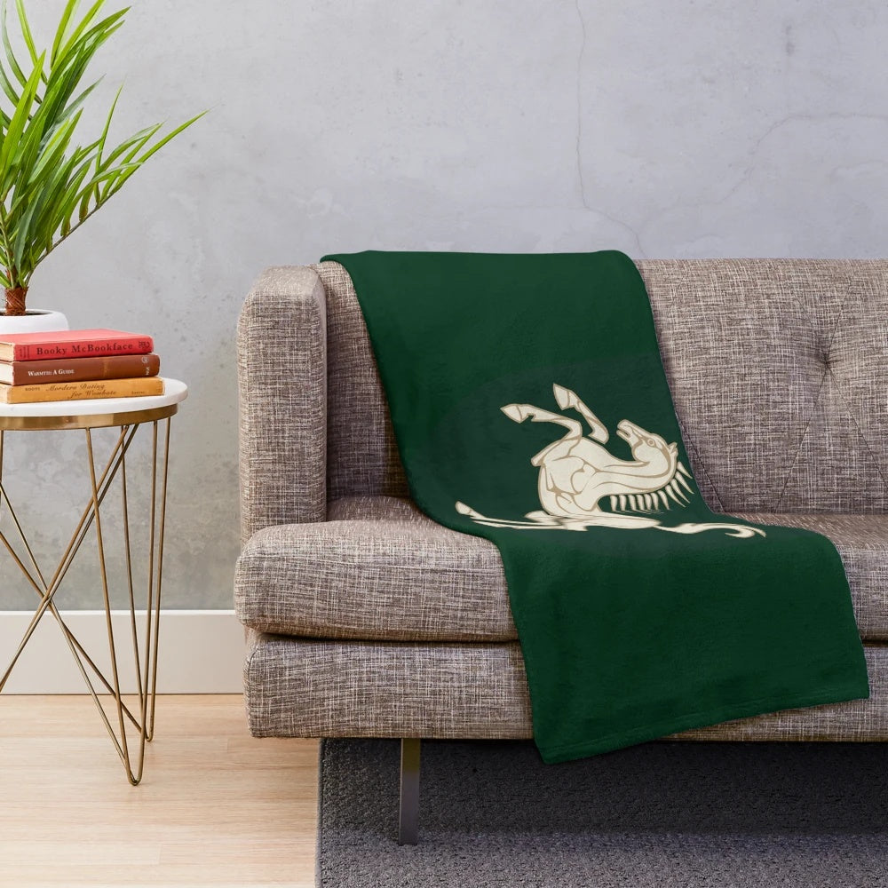 Rohan-themed plush blanket with embroidered crest