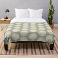 Soft, round plush blanket in a neutral color for cozy relaxation