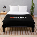 Rust game logo printed on a soft, plush blanket
