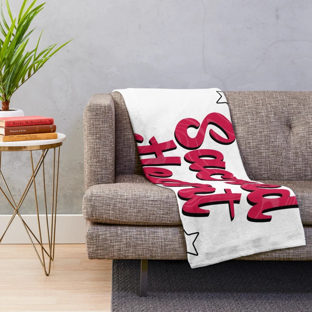 Soft and cuddly plush blanket featuring the Sacred Heart University logo