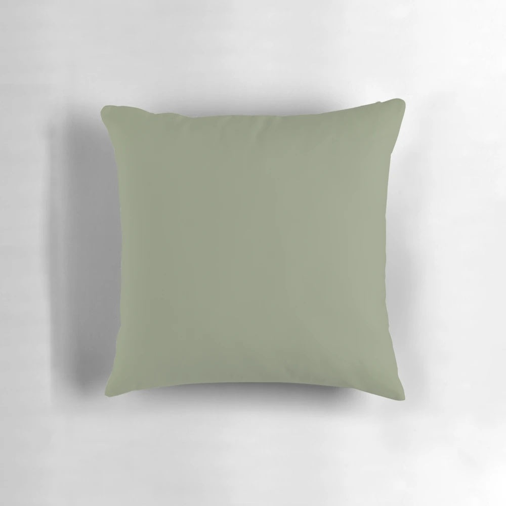 Sage green pillow with a soft, solid color design