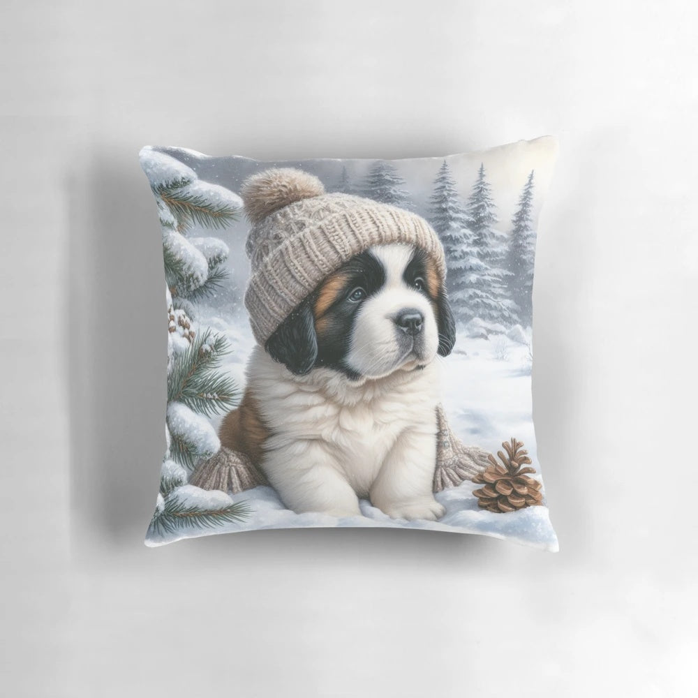 A cute Saint Bernard puppy wearing a winter hat and sitting on a snow-themed pillow.