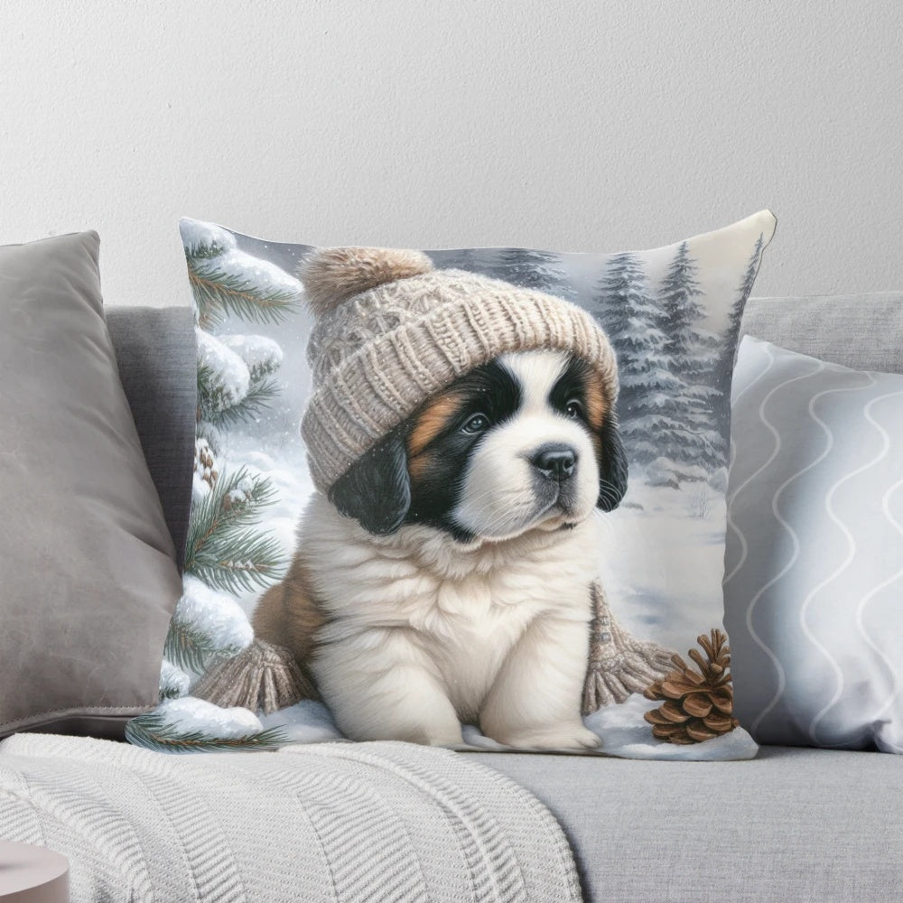 A cute Saint Bernard puppy wearing a winter hat and sitting on a snow-themed pillow.