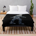 Sasquatch silhouette design on a cozy plush blanket