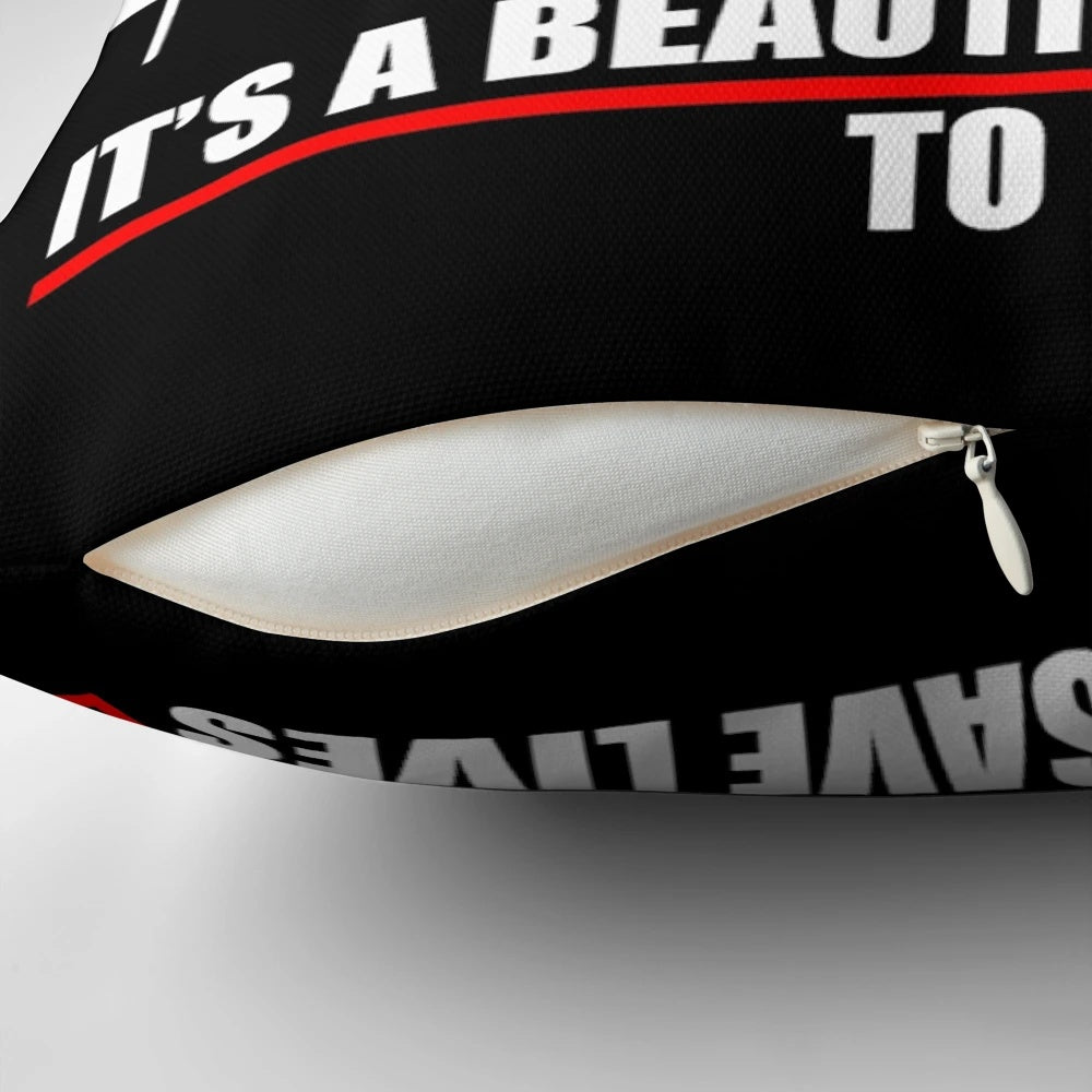 A plush pillow with the text 'Save Lives' on a plain background, inspired by the hit TV show Grey's Anatomy.