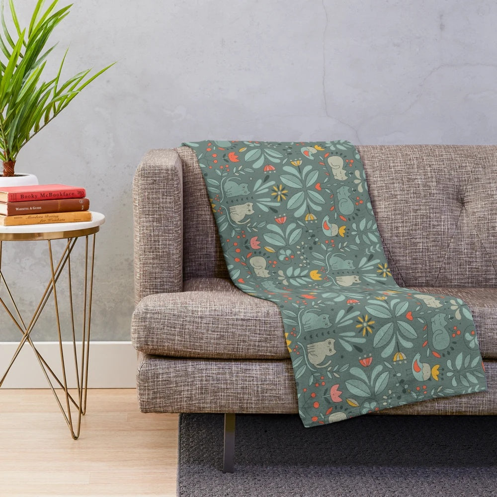 Soft and cuddly plush blanket featuring a charming abstract pattern of colorful Swedish folk-style cats