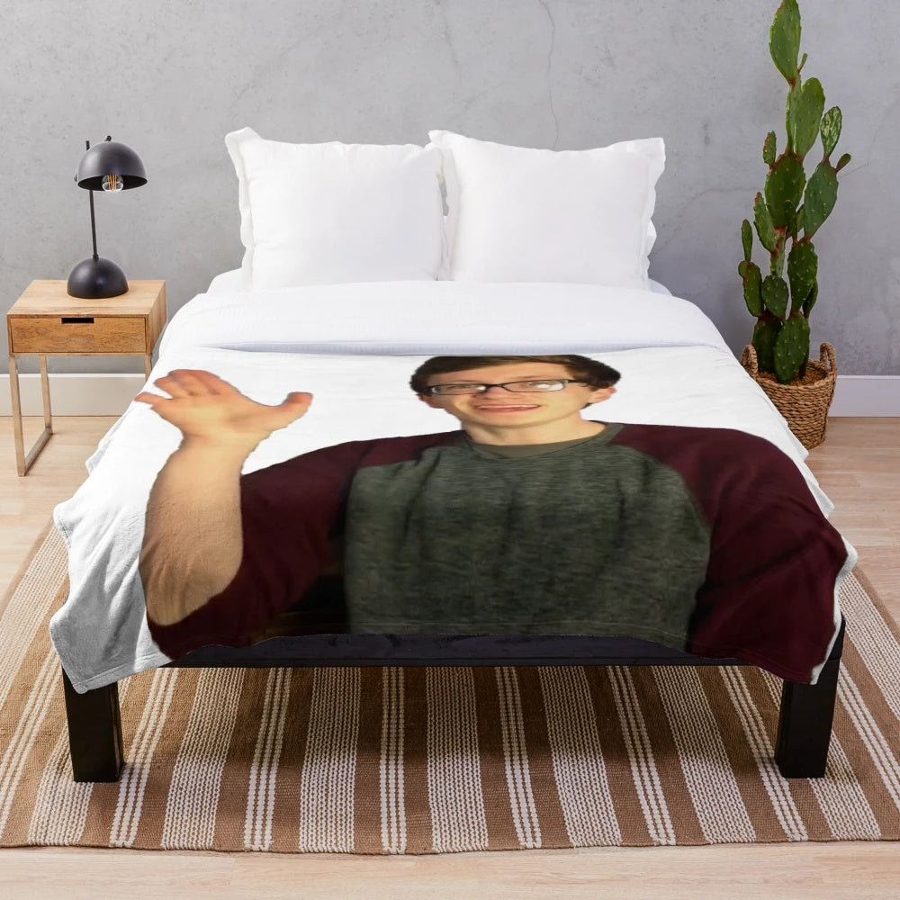 Image of a soft, plush blanket featuring the popular YouTube gaming creator, Scott the Woz.