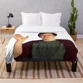 Image of a soft, plush blanket featuring the popular YouTube gaming creator, Scott the Woz.