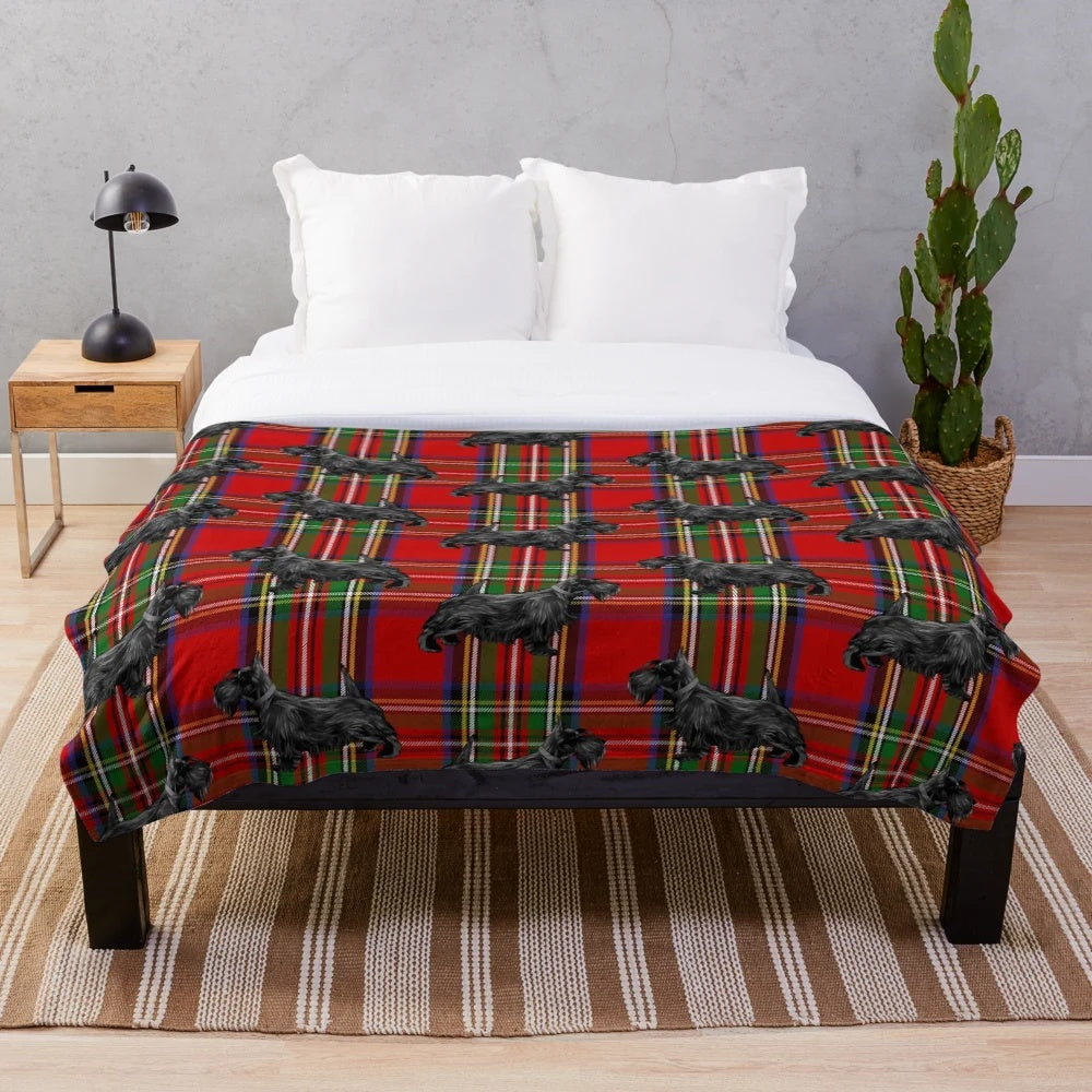 Soft and snuggly plush blanket featuring a scottie dog on a red Scottish tartan pattern