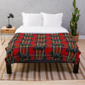 Soft and snuggly plush blanket featuring a scottie dog on a red Scottish tartan pattern