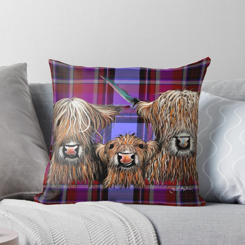 A soft, plush pillow featuring a friendly, nosey Scottish Highland cow in a vibrant tartan pattern.