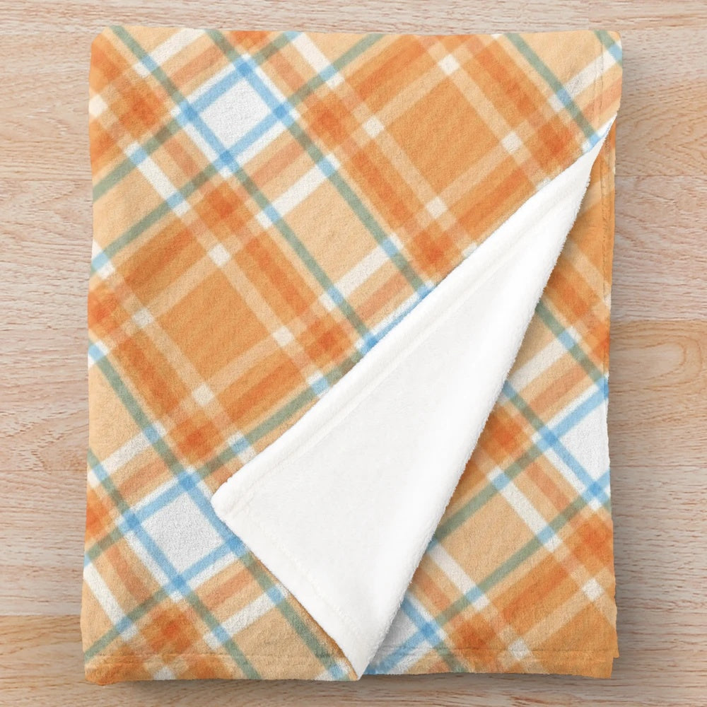 Soft and plush Scottish plaid blanket with a geometric textile design