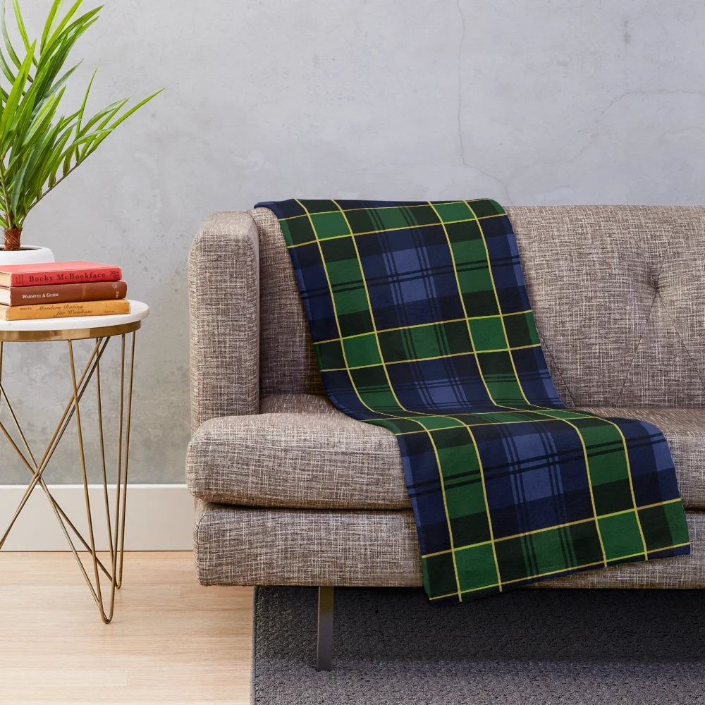 Plush blanket with a classic Scottish tartan plaid design in blue and green colors