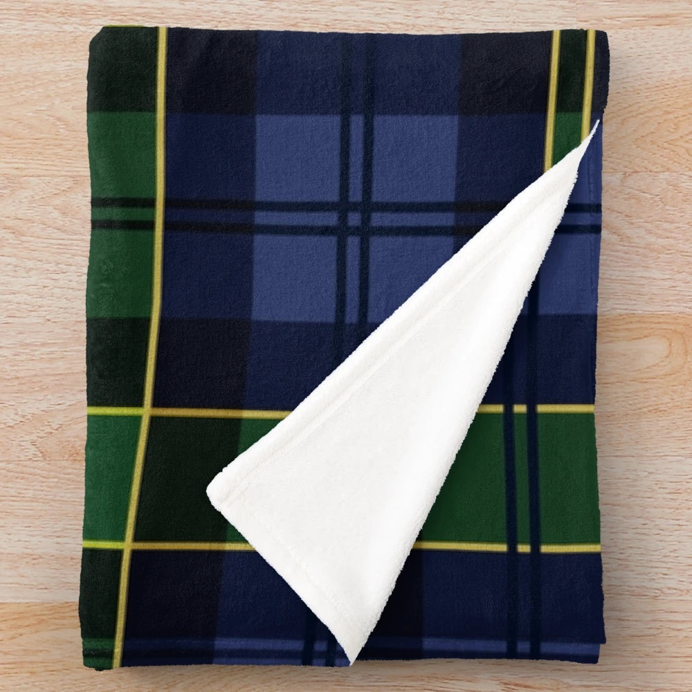 Plush blanket with a classic Scottish tartan plaid design in blue and green colors