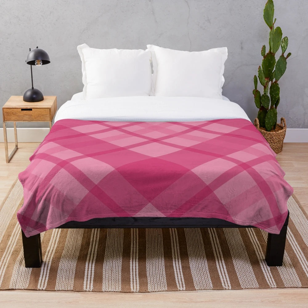 Scottish tartan plush blanket in pink and red tones