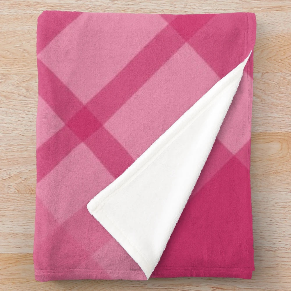 Scottish tartan plush blanket in pink and red tones