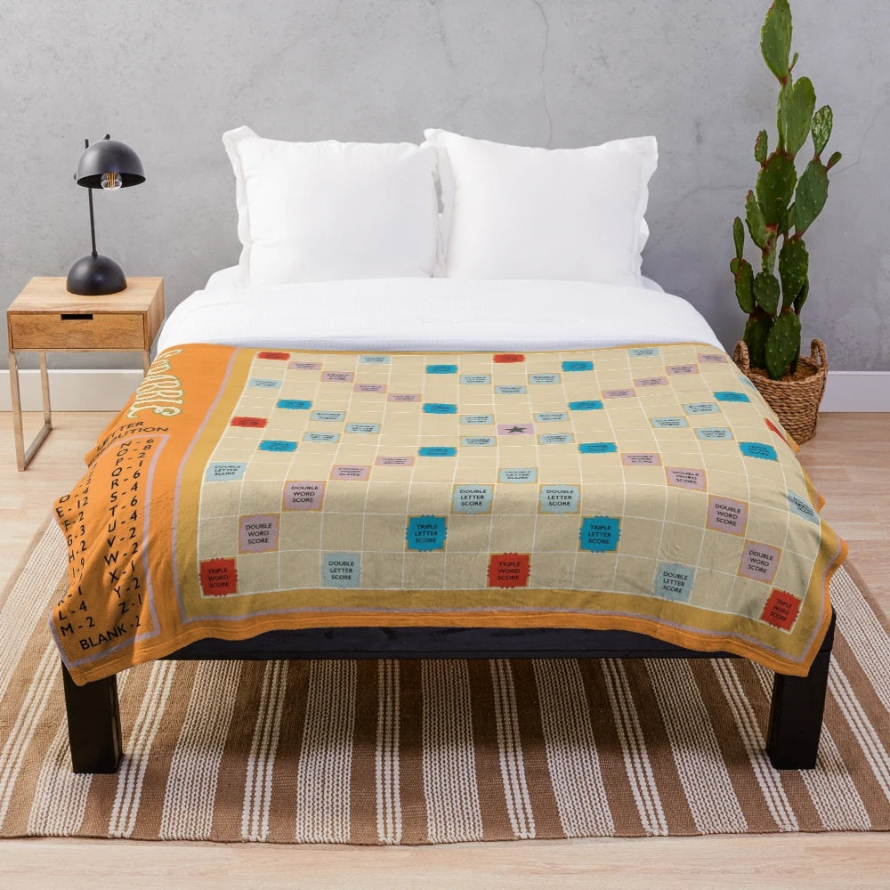 Scrabble-themed plush blanket with game tiles