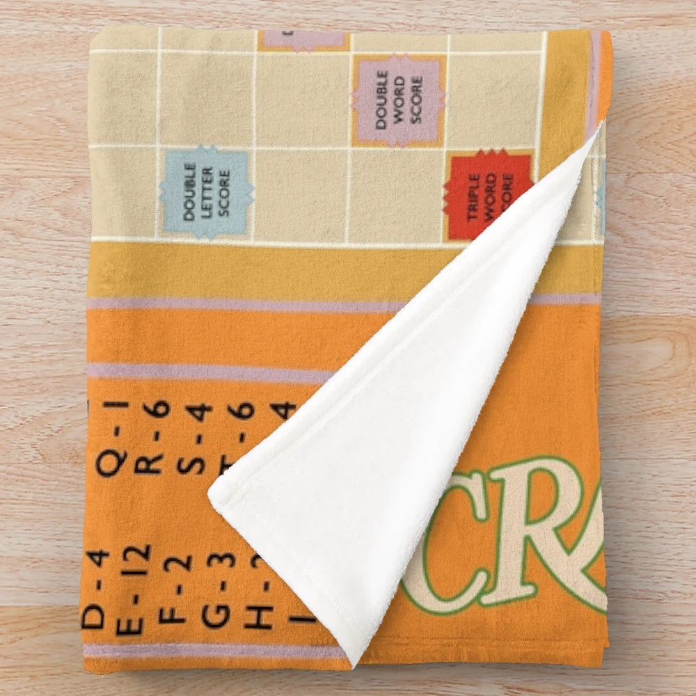Scrabble-themed plush blanket with game tiles
