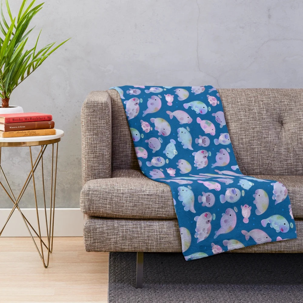 Soft, cuddly plush blanket featuring a sea cow (sirenians) design