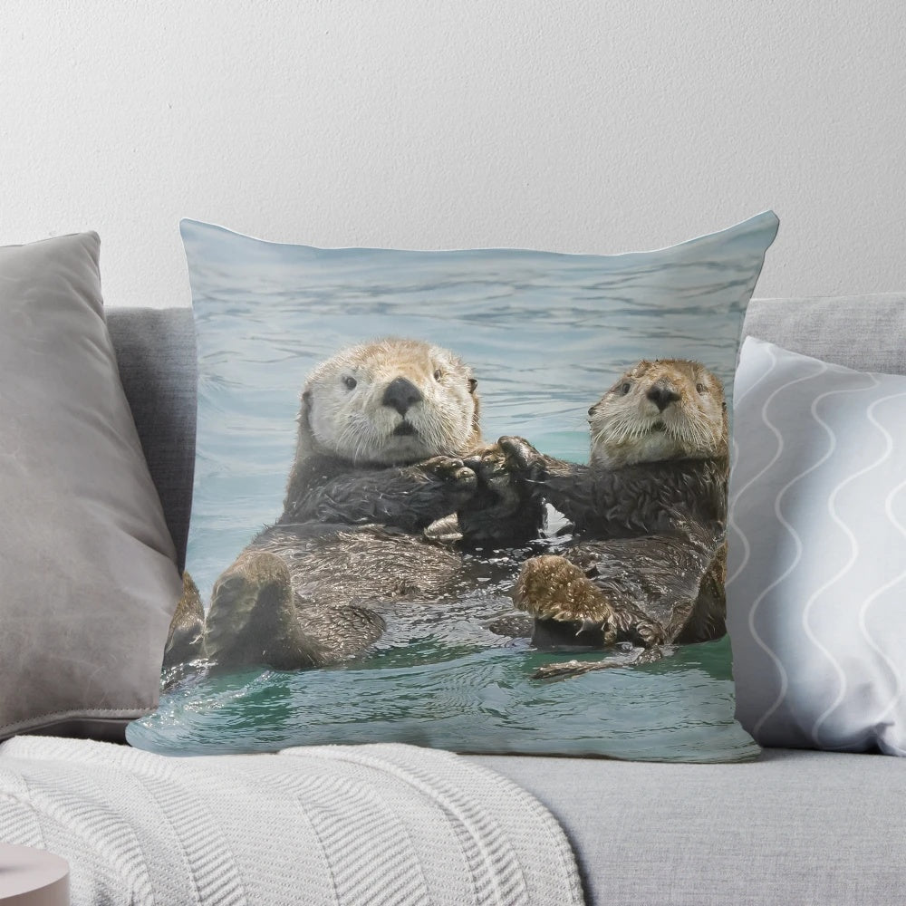 A soft, plush pillow featuring a high-quality image of a cuddly sea otter, perfect for sea otter and nature lovers.