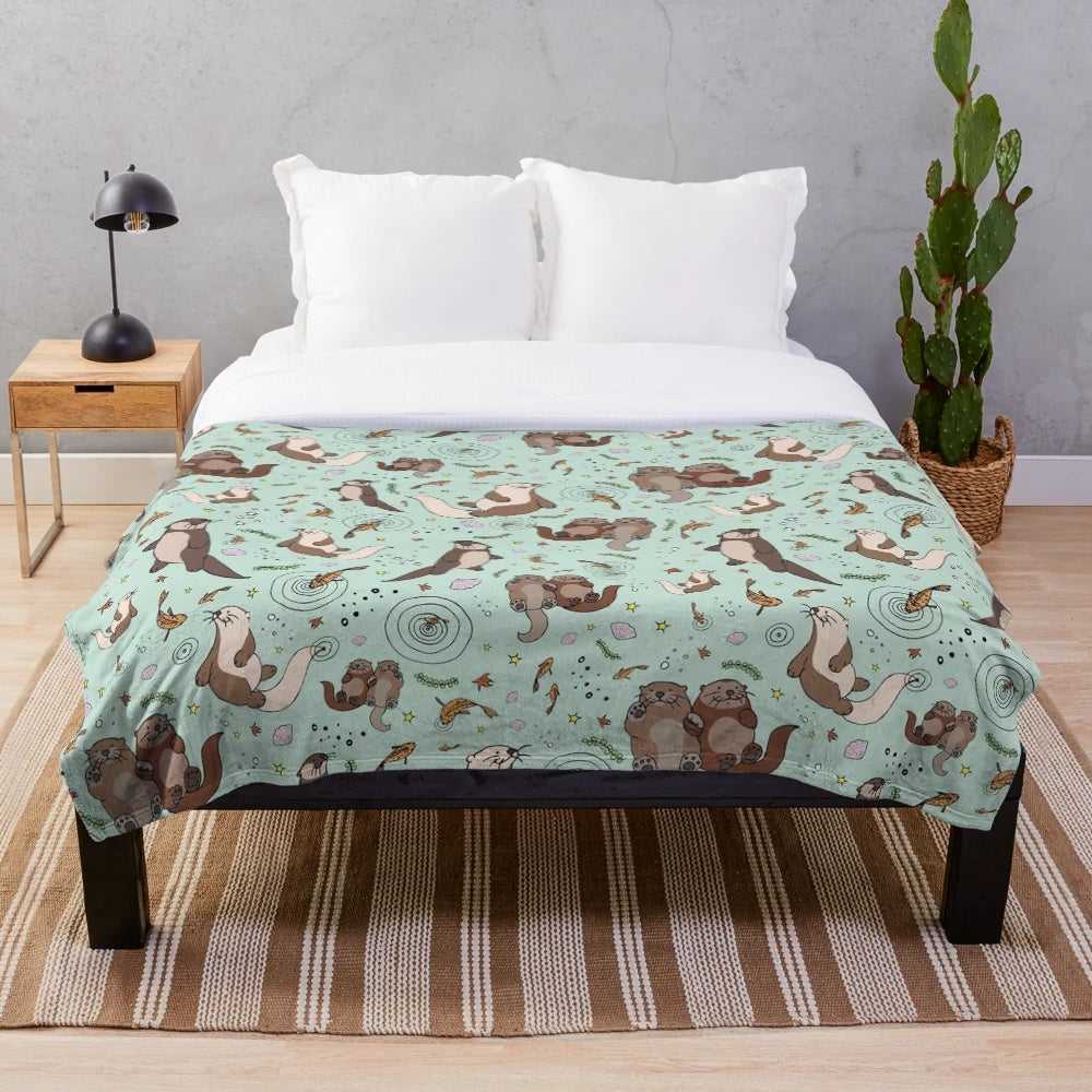 Soft and cuddly sea otter plush blanket with a cute otter design