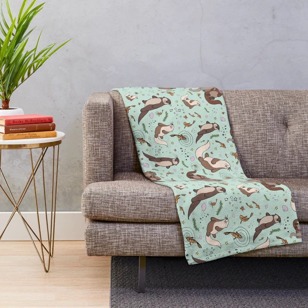 Soft and cuddly sea otter plush blanket with a cute otter design