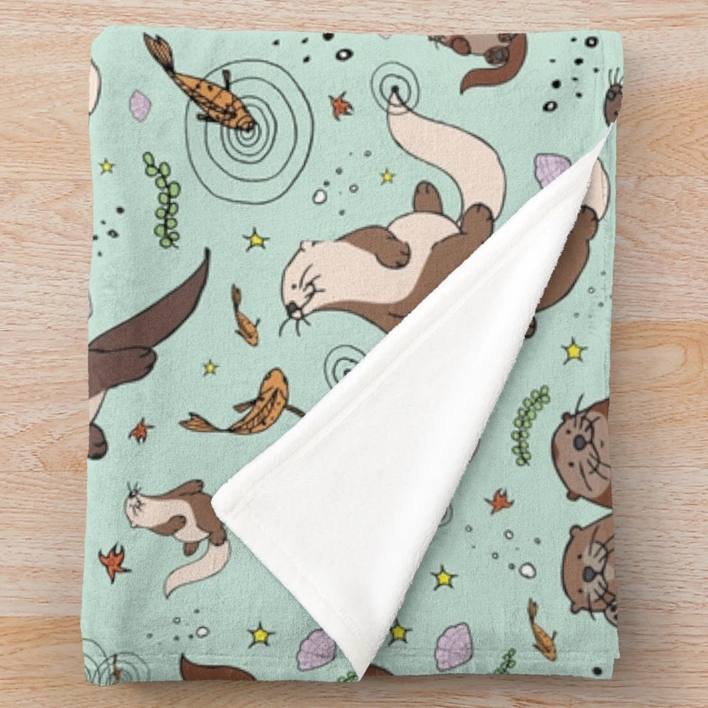 Soft and cuddly sea otter plush blanket with a cute otter design