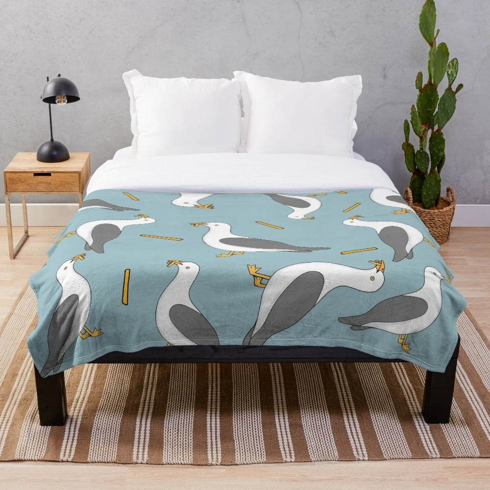 Soft plush blanket featuring a seagull and fish and chips design, perfect for summer beach-themed home decor