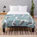 Soft plush blanket featuring a seagull and fish and chips design, perfect for summer beach-themed home decor