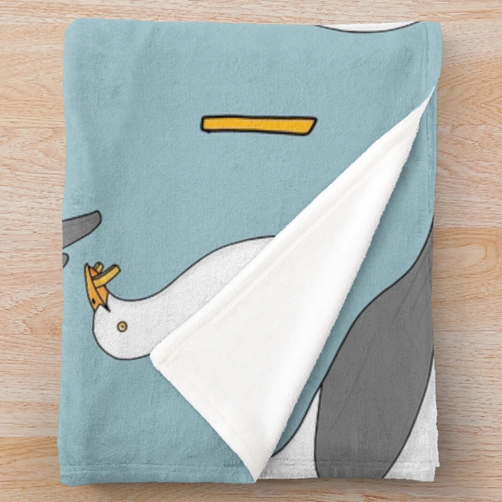 Soft plush blanket featuring a seagull and fish and chips design, perfect for summer beach-themed home decor