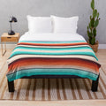 Navajo-inspired striped plush blanket in fall colors