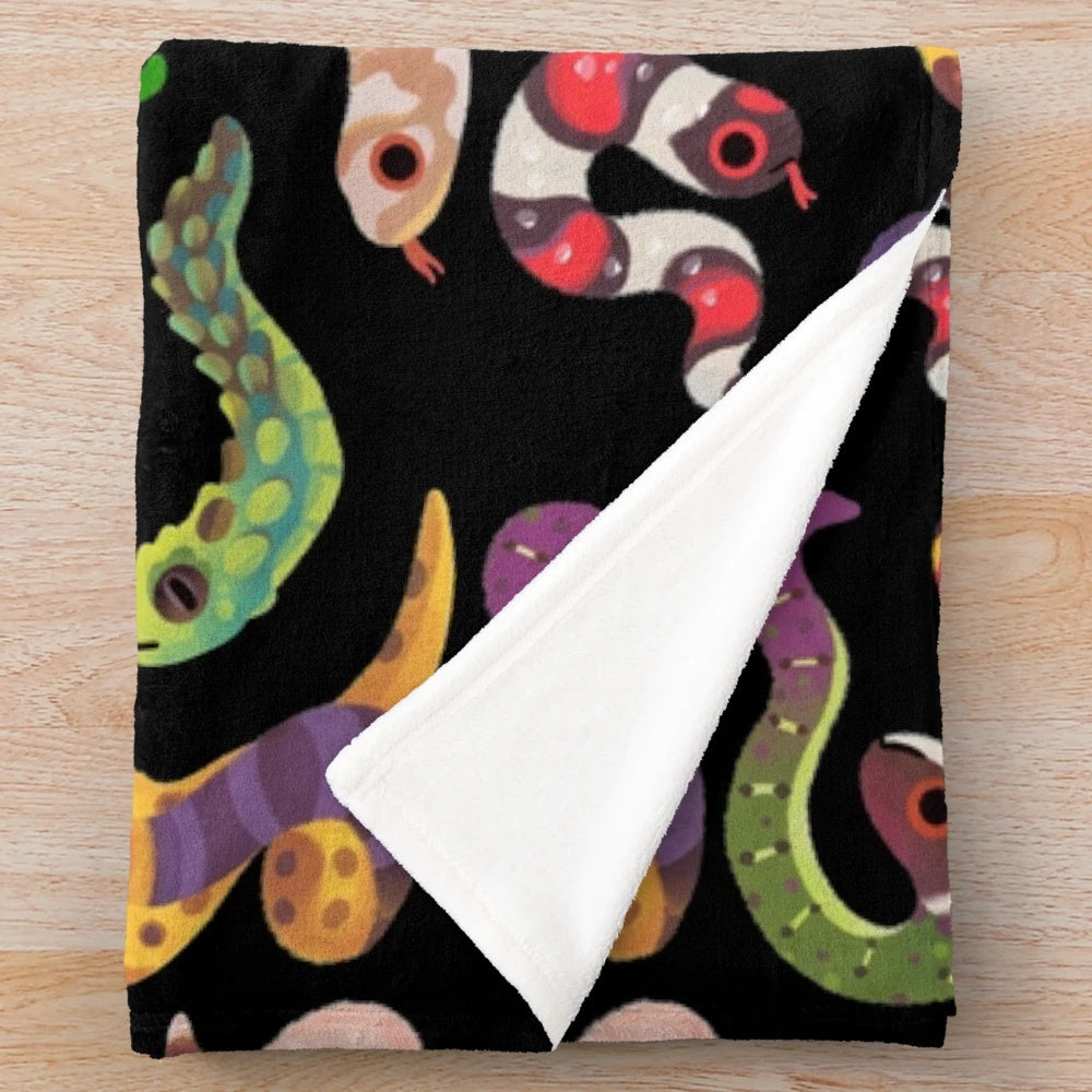 Soft plush blanket with a serpent or snake design, ideal for animal lovers