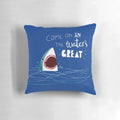 A soft, plush shark-shaped pillow with a playful typographic design, perfect for adding a touch of ocean-inspired style to any room.