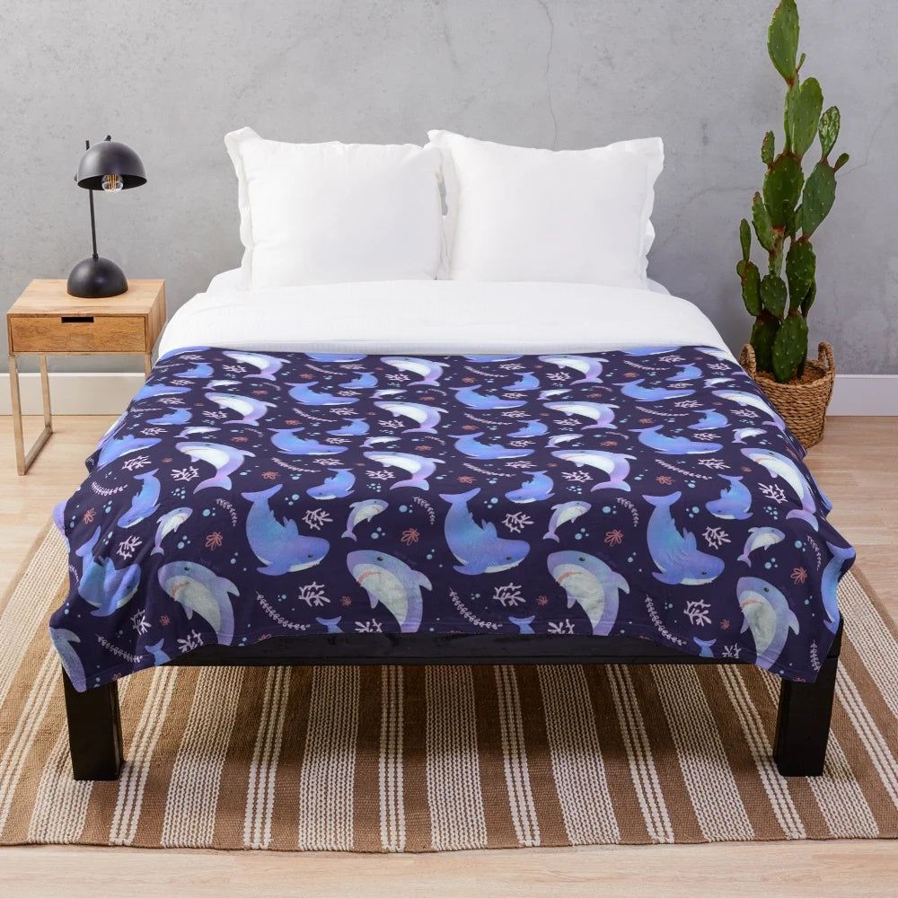 Soft and cuddly plush blanket featuring an adorable shark design in an underwater scene