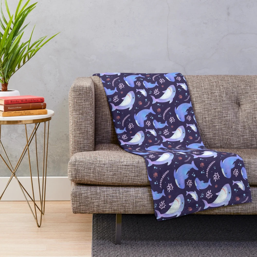 Soft and cuddly plush blanket featuring an adorable shark design in an underwater scene