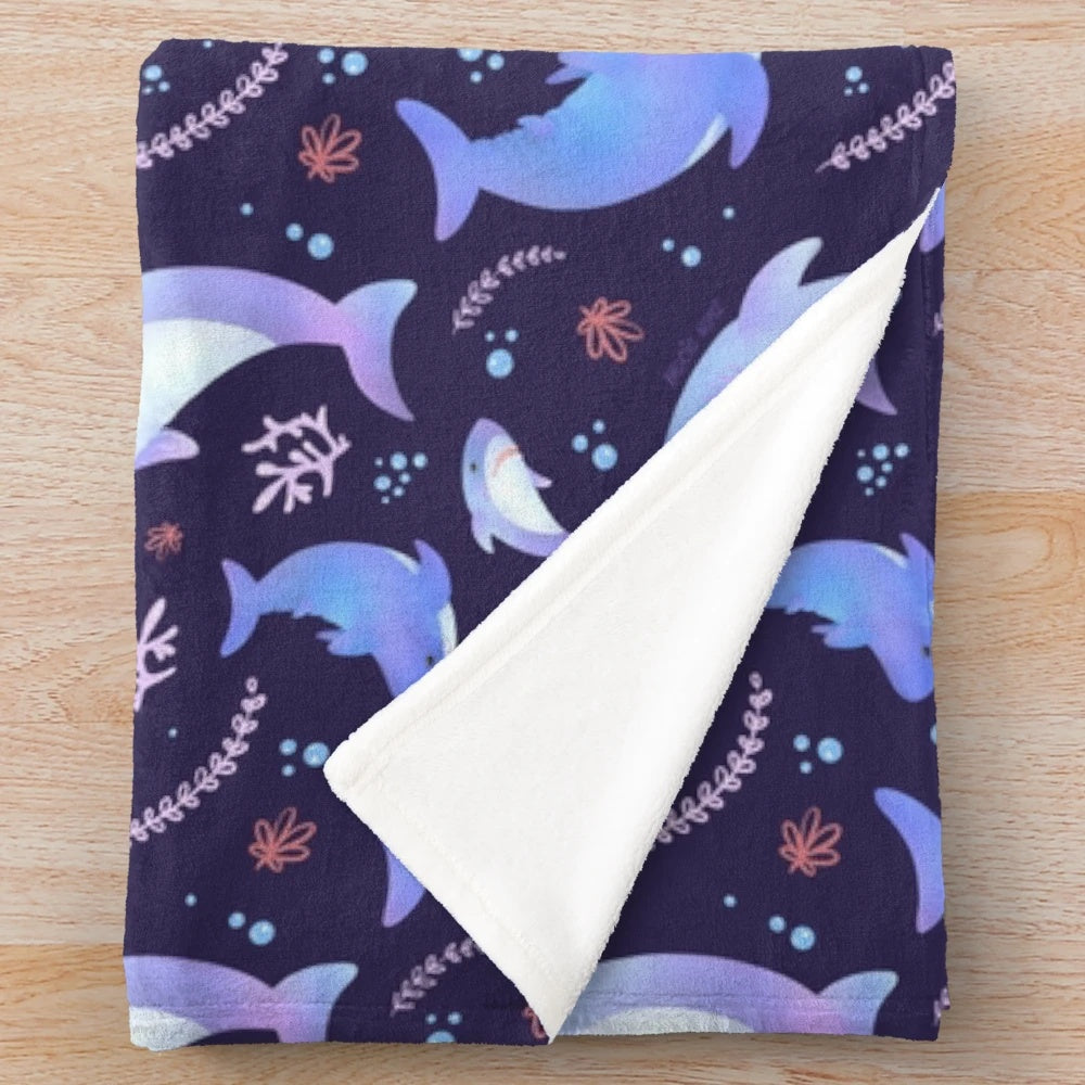 Soft and cuddly plush blanket featuring an adorable shark design in an underwater scene