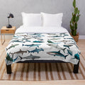 Soft and cuddly sharks plush blanket with various shark species
