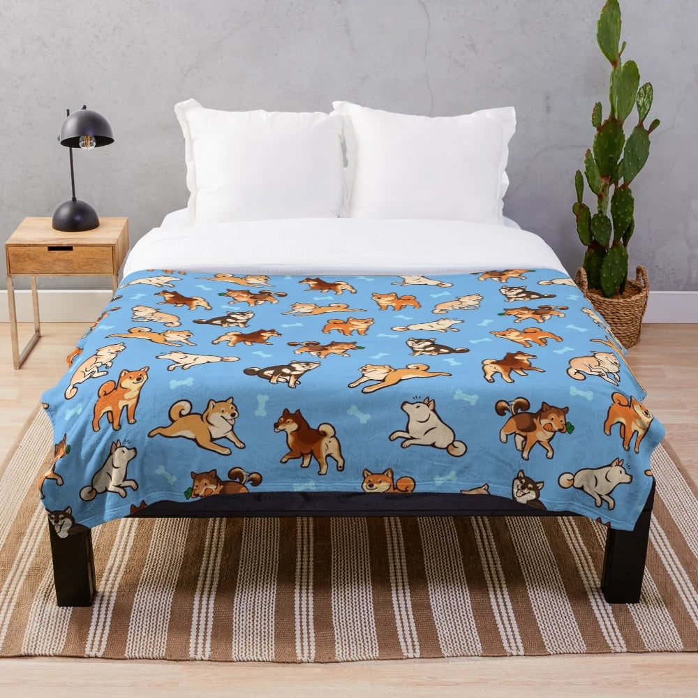 Plush blue blanket with cute shiba inu dog pattern