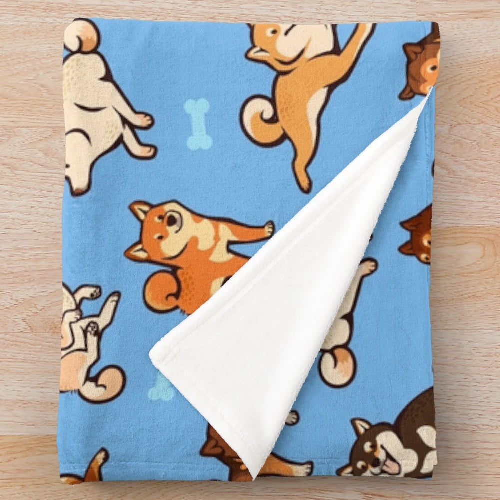 Plush blue blanket with cute shiba inu dog pattern