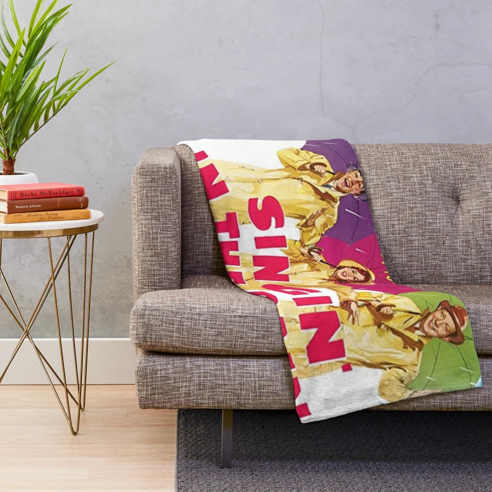 Plush blanket featuring a vintage 'Singing in the Rain' scene
