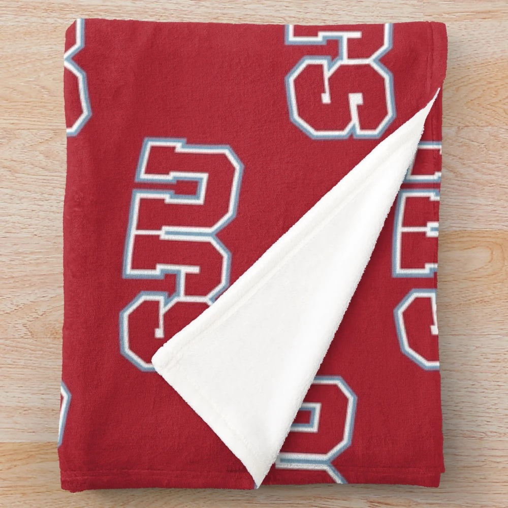 Soft, plush blanket featuring a rat design inspired by Saint Johns University.