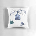 A plush pillow featuring a snowy winter sports scene with skiers on a ski lift against a backdrop of powdery hills.