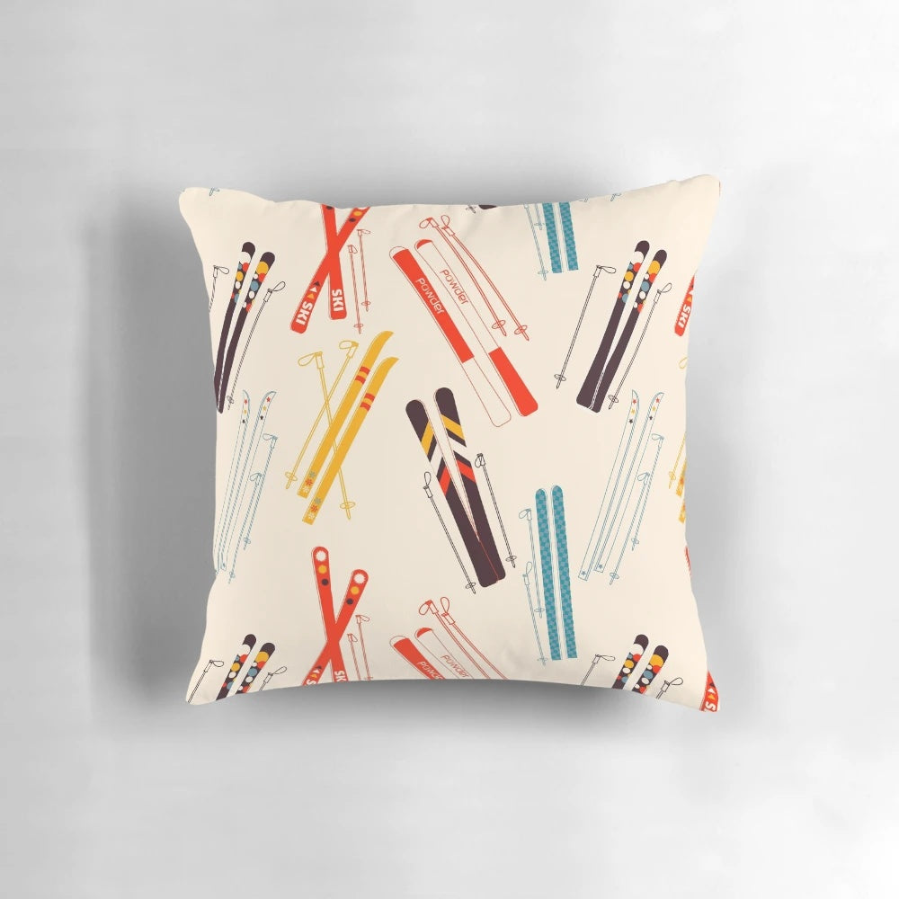 Skiing-themed decorative pillow featuring a snow-covered mountain landscape