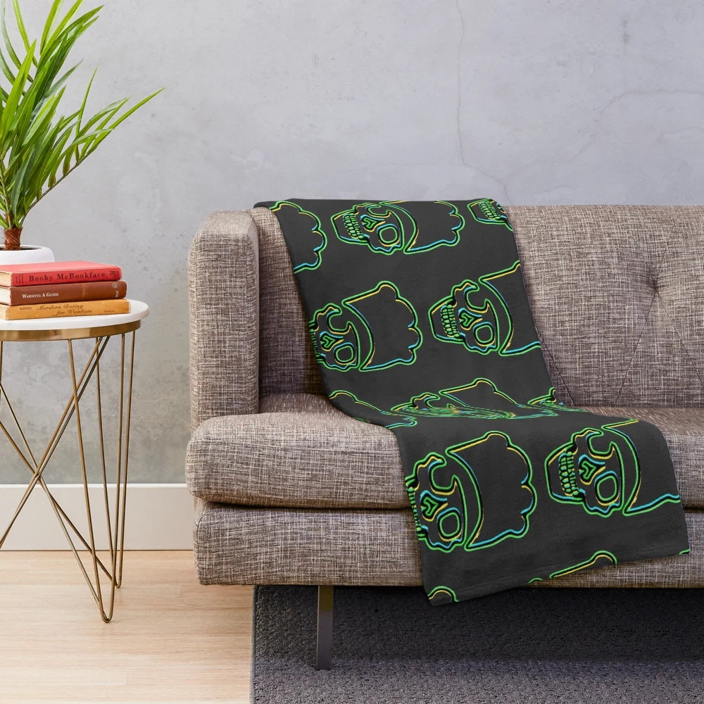 Green plush blanket with a skull chef design, great for kitchen and cooking enthusiasts