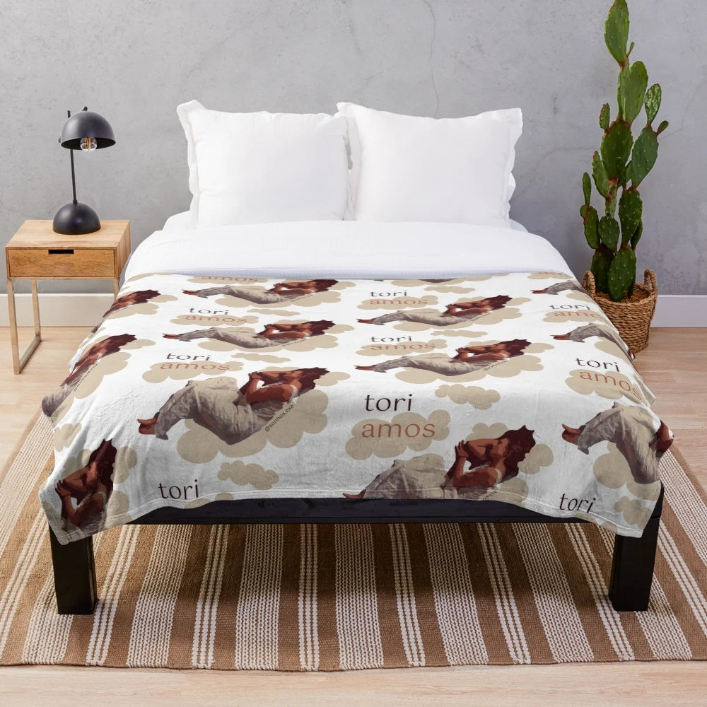 Plush blanket featuring a dreamy, cloud-like illustration inspired by singer-songwriter Tori Amos