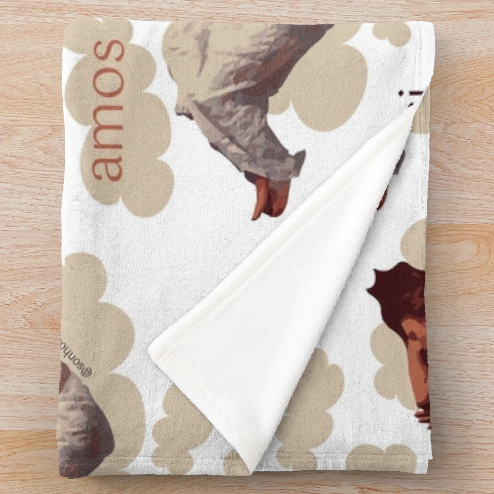 Plush blanket featuring a dreamy, cloud-like illustration inspired by singer-songwriter Tori Amos