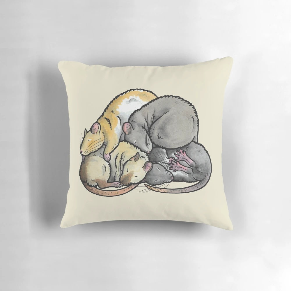 Adorable sleeping pet rats cuddled together in a soft, plush pillow