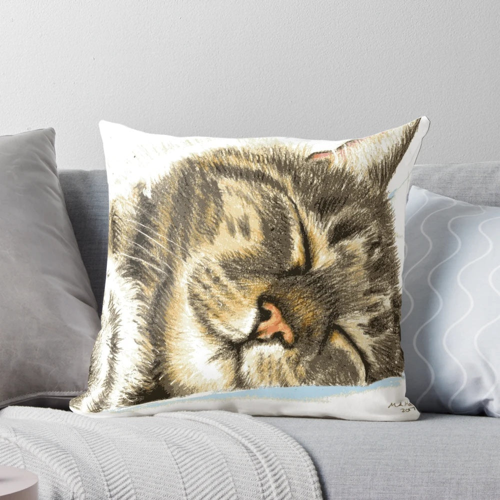 Soft and plush pillow featuring a sleeping tabby cat illustration, perfect for cat enthusiasts.